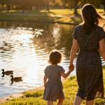 mom and kid walking in the park